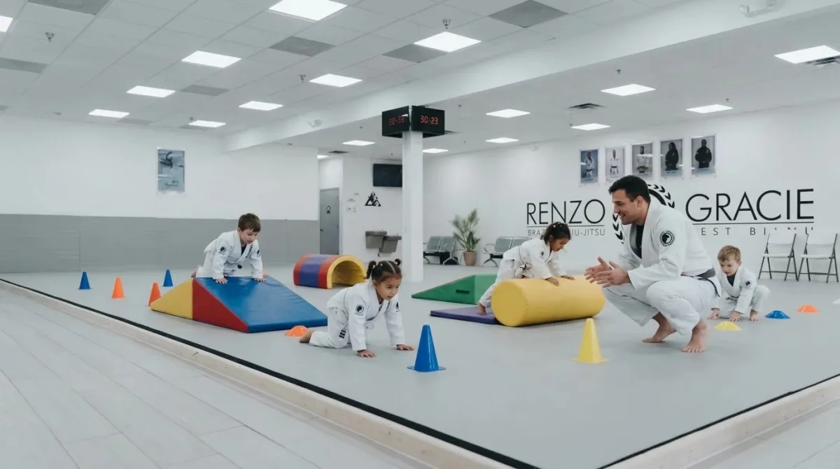 Preschool children crawling through a soft obstacle course on a mat while an instructor cheers