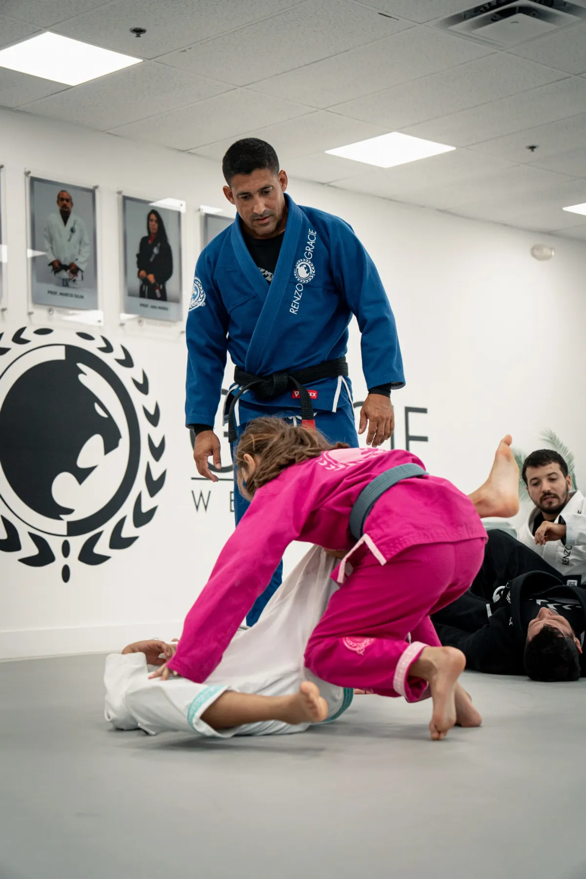 Kids smiling in kimonos during a class at Renzo Gracie West Boca Raton