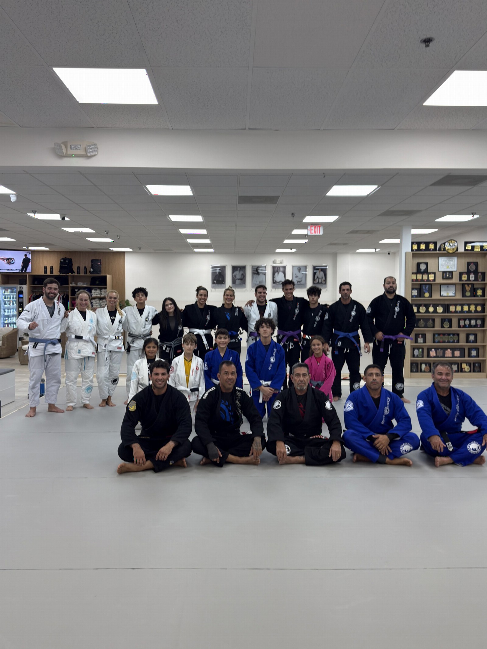 The Renzo Gracie West Boca Raton team and students posing together on the mat